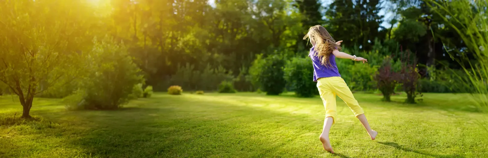 girl running on lawn